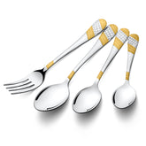 Elegant fork and three spoons with gold-silver textured handles displayed diagonally on white background.